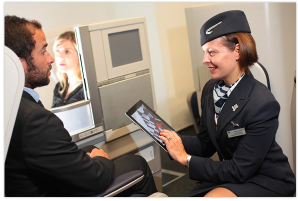 member of British Airways cabin crew using an iPad
